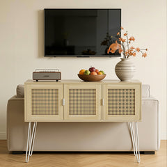 Beige sideboard with wicker doors, television above, and decorative items on a light-colored wall.